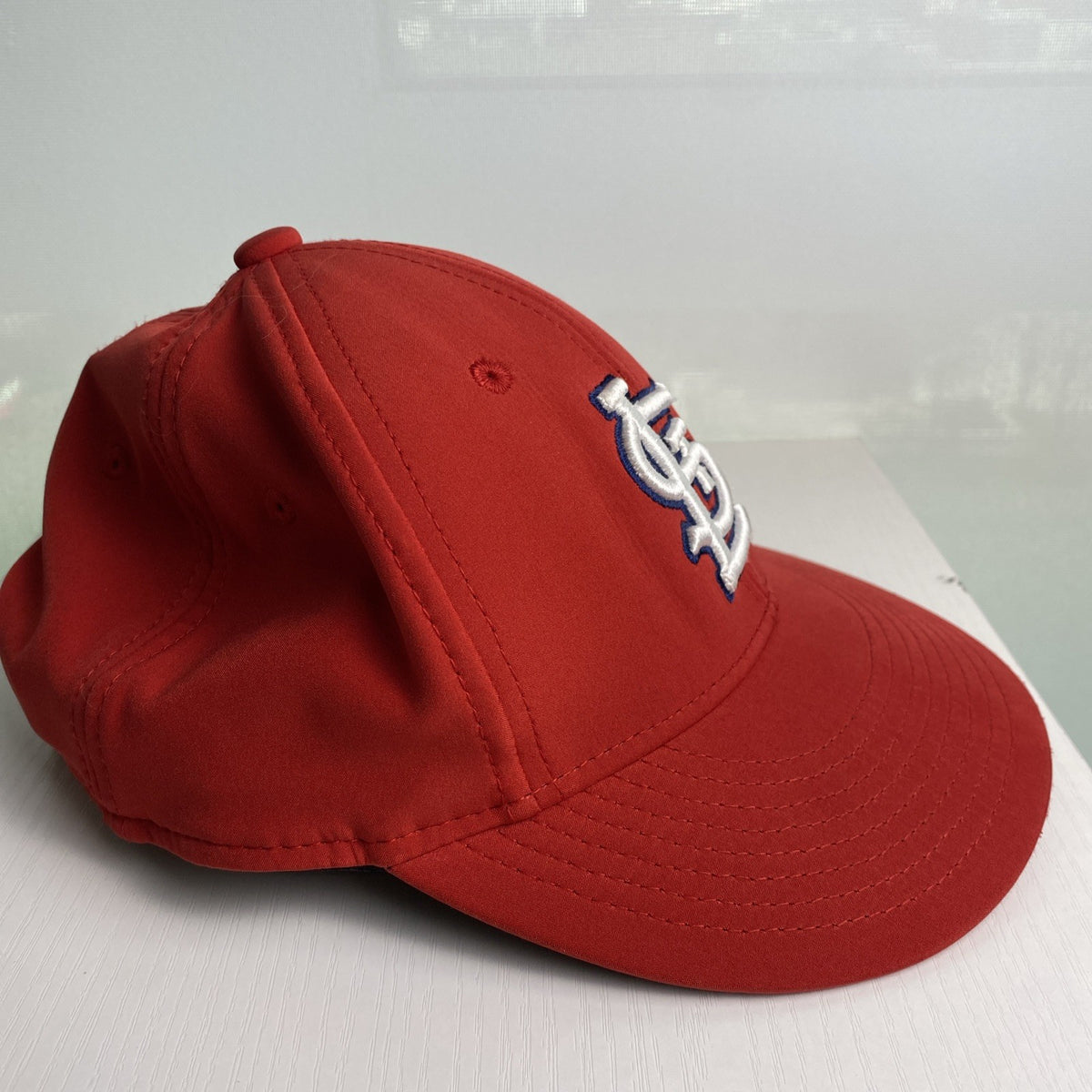 St. Louis Cardinals red MLB baseball cap with raised embroidered STL logo and adjustable strap