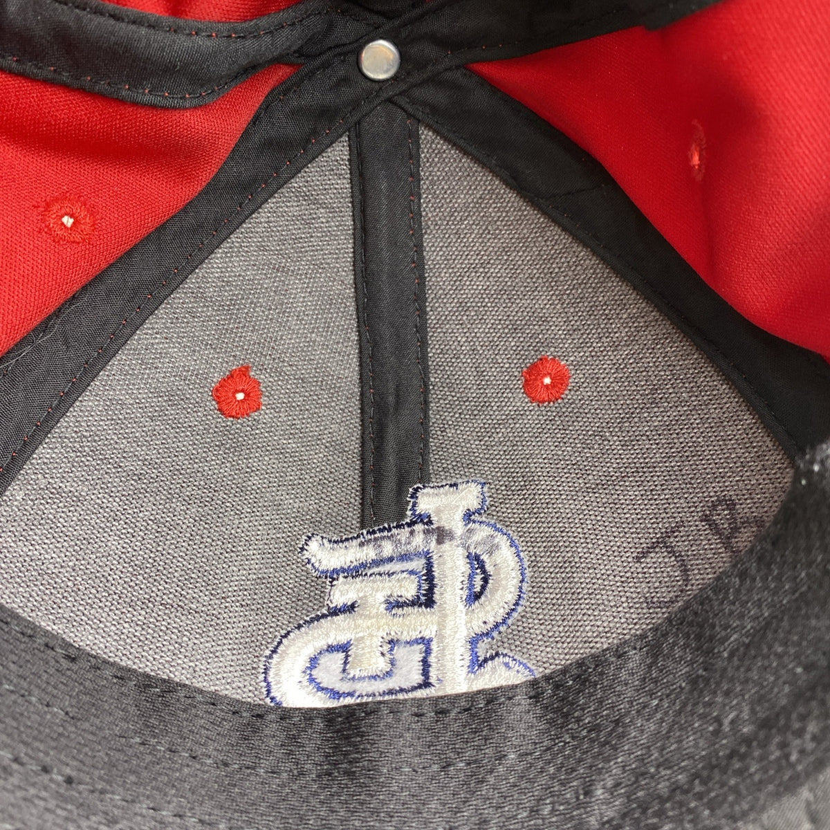 St. Louis Cardinals red MLB baseball cap with raised embroidered STL logo and adjustable strap