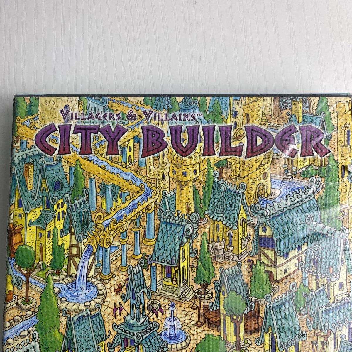 Studio 9 Games Villagers & Villains City Builder tabletop game expansion box in protective wrap