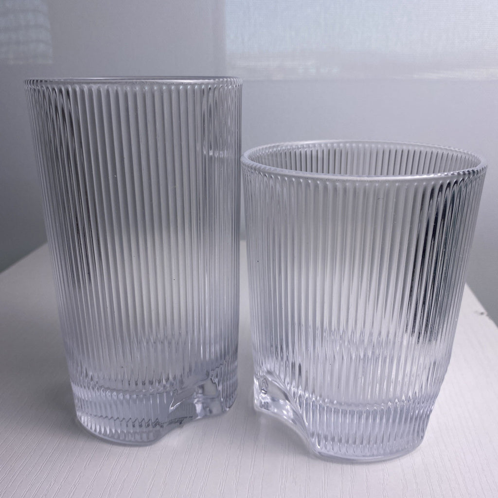 Set of four Schott Zwiesel Bar Selection Fave clear fluted glass tumbler drinking glasses.