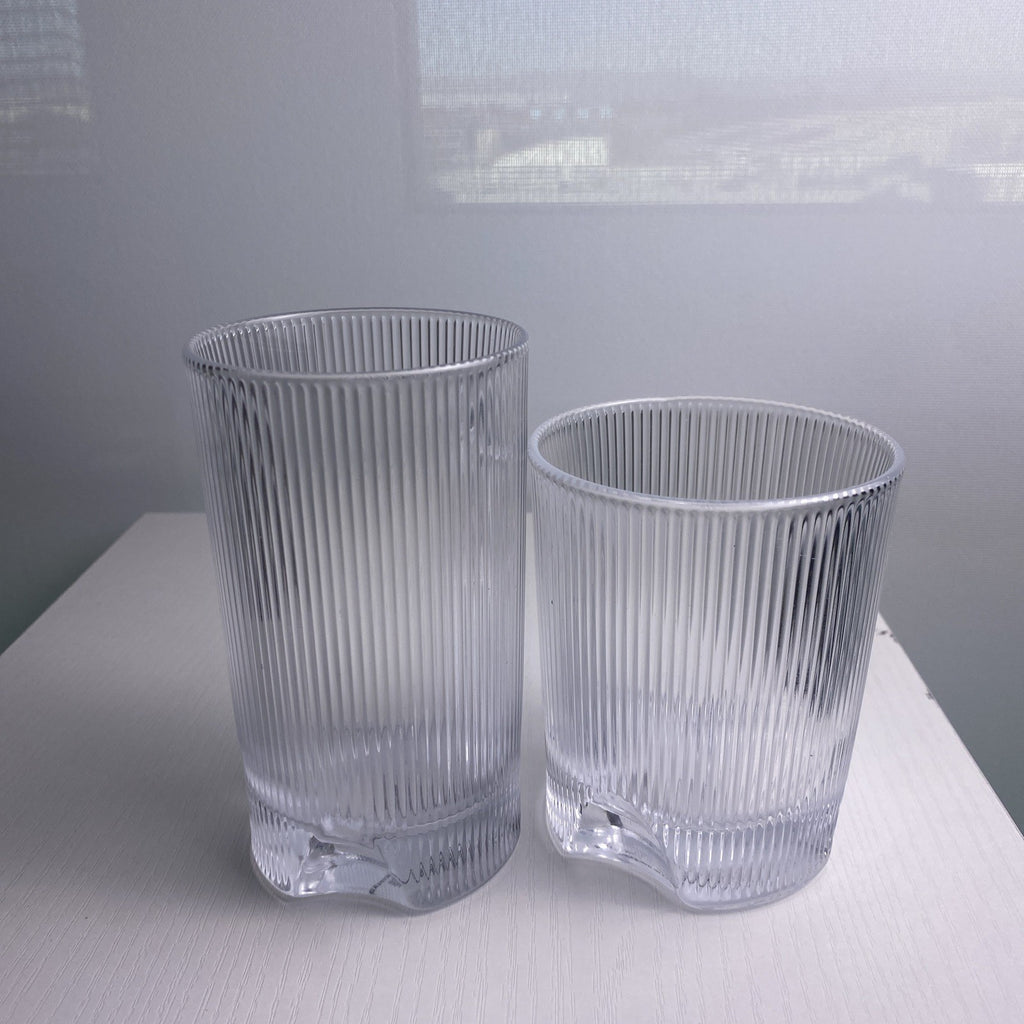 Set of four Schott Zwiesel Bar Selection Fave clear fluted glass tumbler drinking glasses.