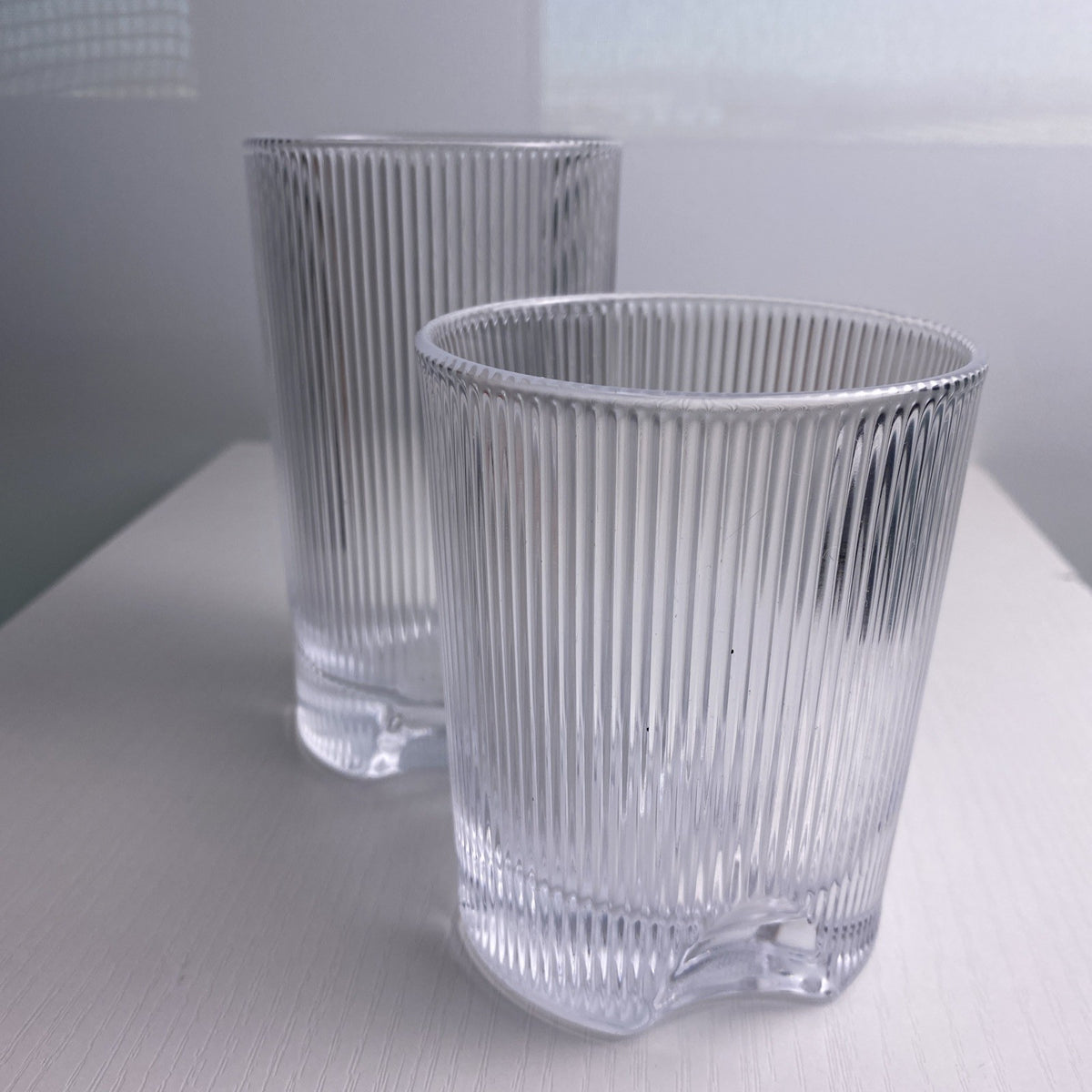 Set of four Schott Zwiesel Bar Selection Fave clear fluted glass tumbler drinking glasses.