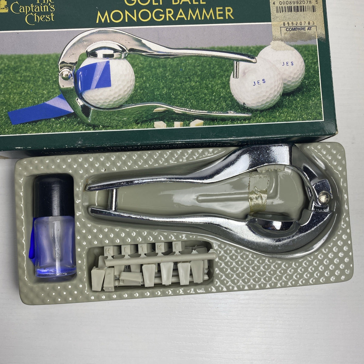 The Captain's Chest chrome metal golf ball monogrammer tool with letter stamps and box