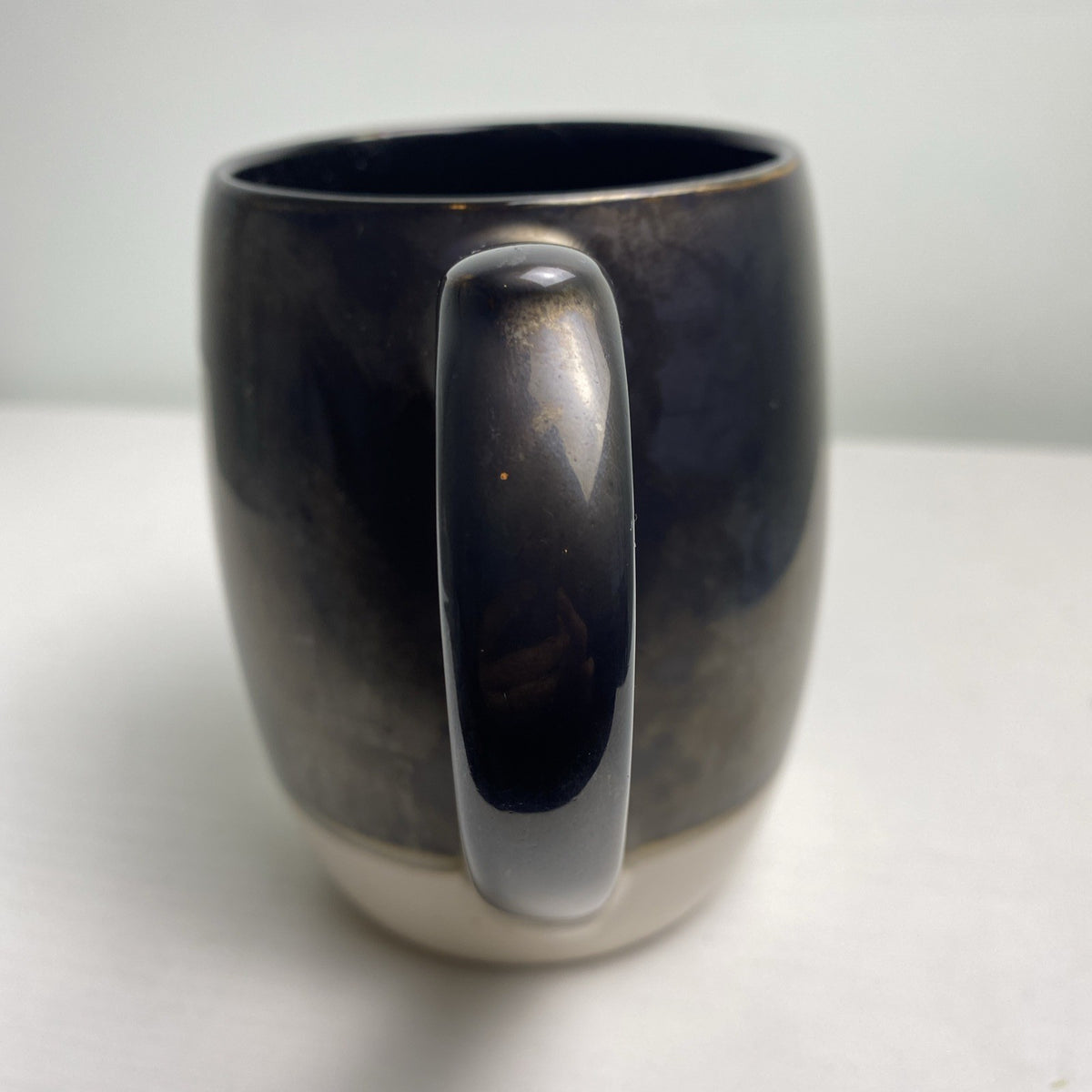 Big Sky Carvers Bearizona stoneware coffee mug with bronze metallic glaze and Arizona map