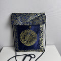 Chinese cobalt blue and gold silk brocade neck pouch featuring a Shou longevity medallion and brass bell toggle