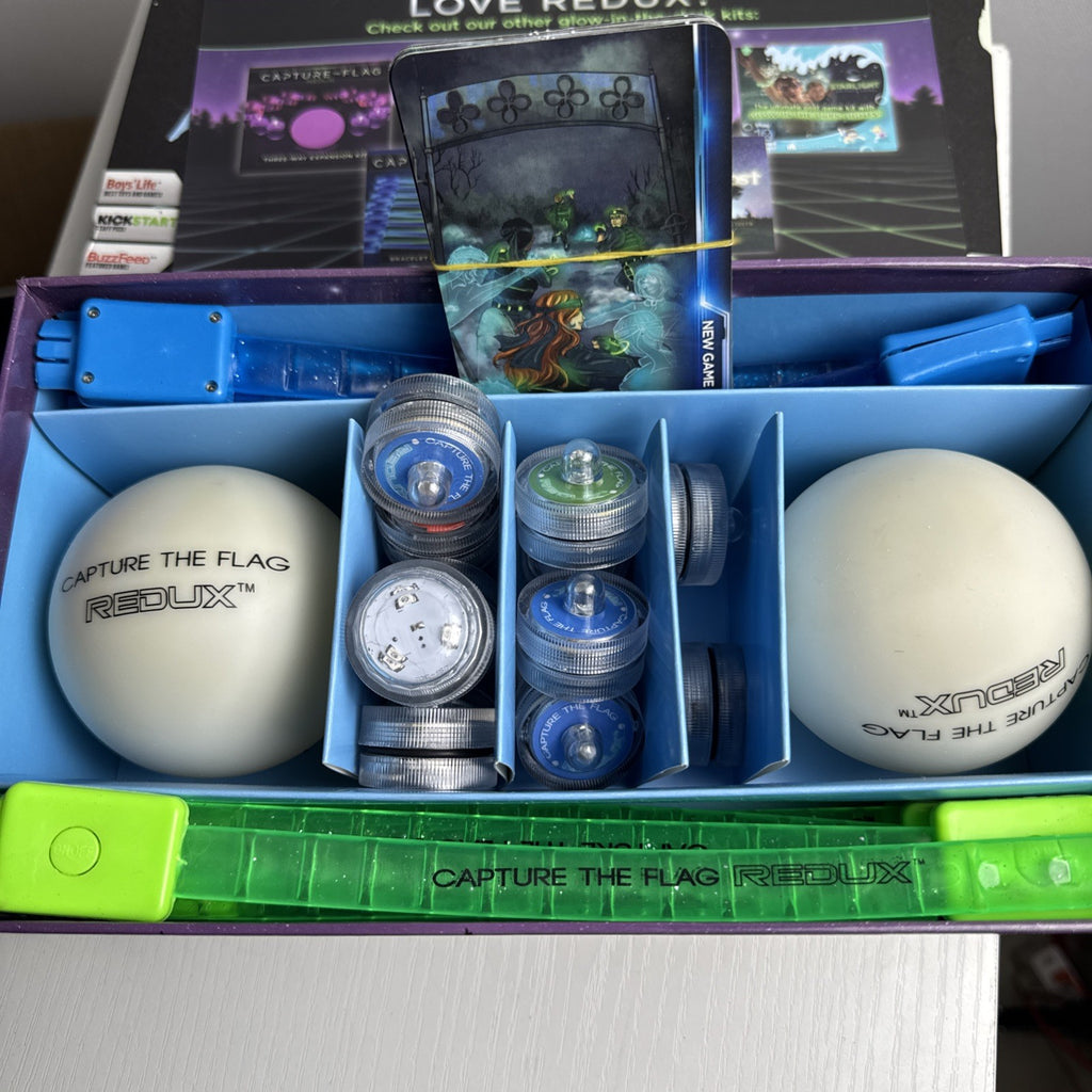 Capture the Flag Redux outdoor LED lawn game set with glowing orbs and box.