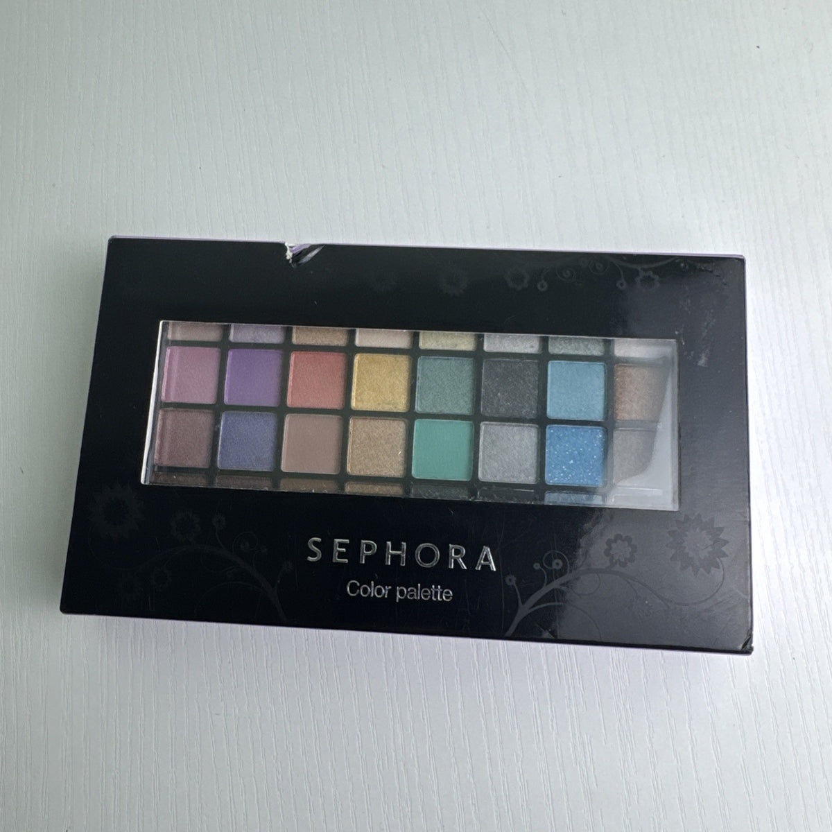 Sephora fold-out multi-tier makeup color palette showing eyeshadows, lip glosses, and face powders in slipcase box.