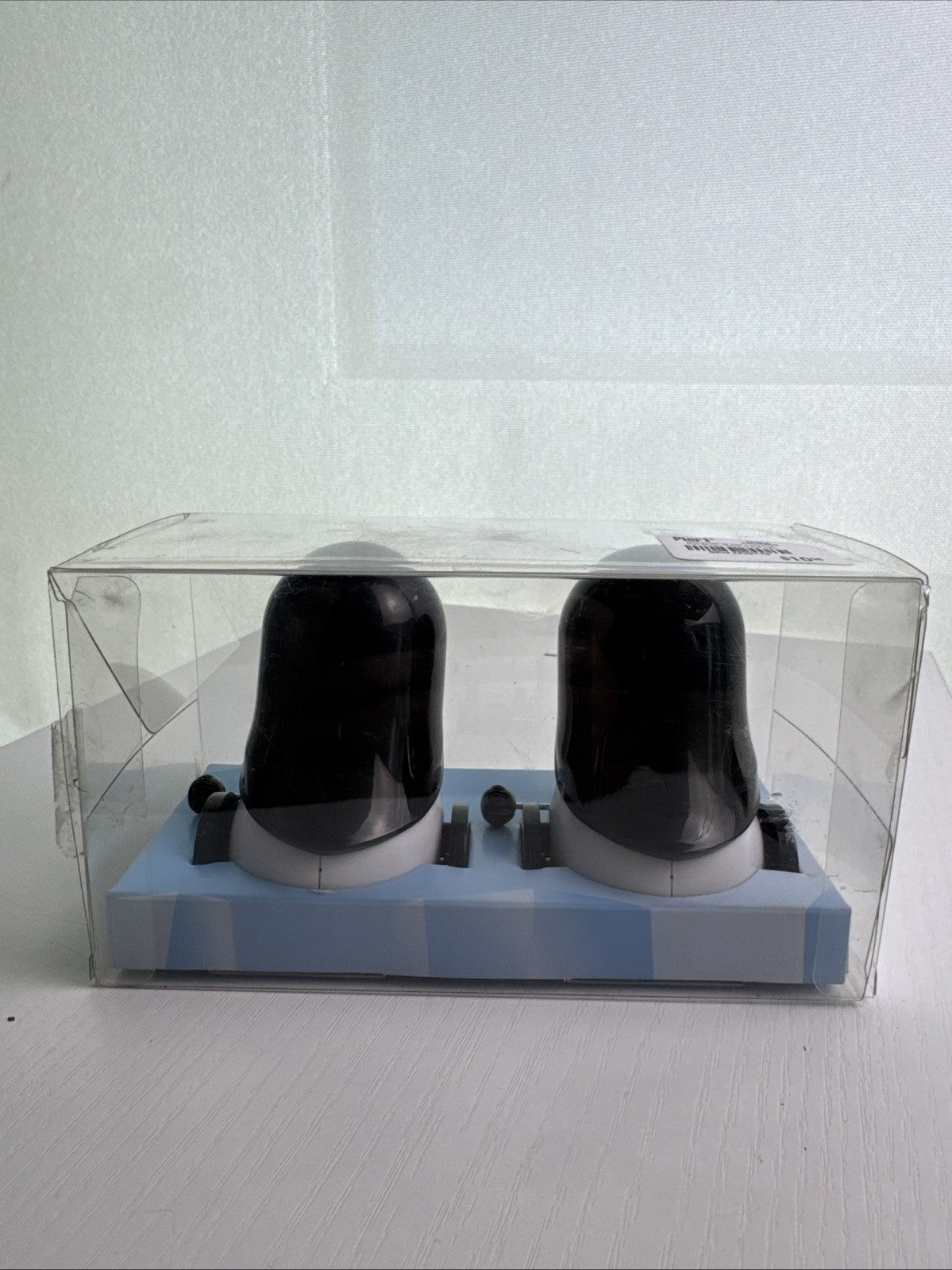 Pier 1 wind-up rolling penguin salt and pepper shakers set in black and white plastic