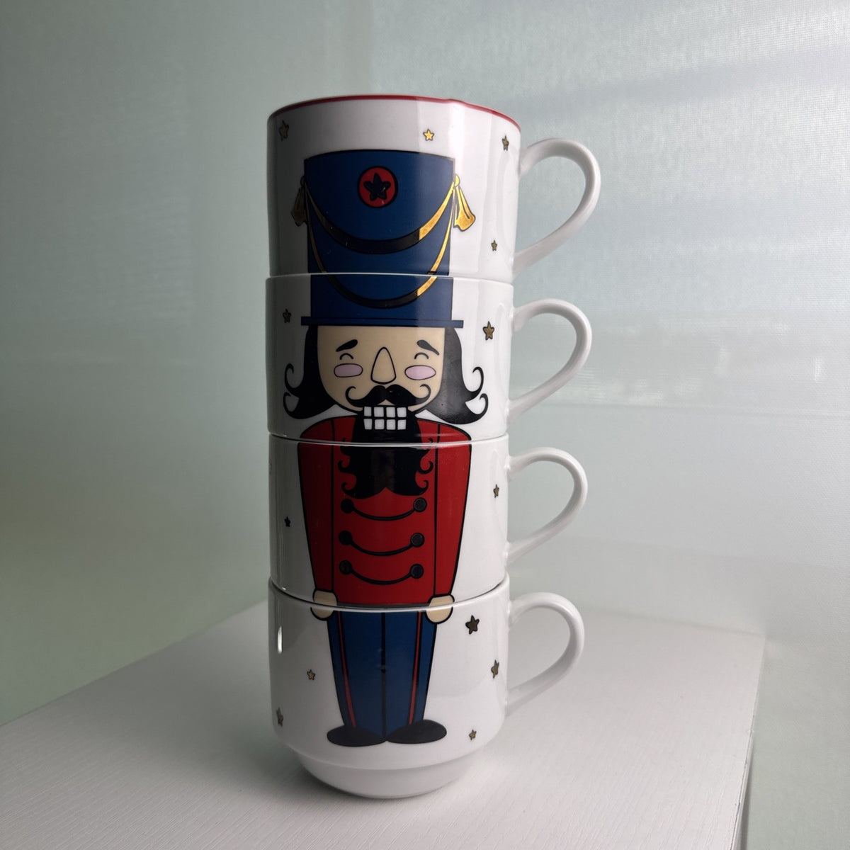 The Cellar stacked porcelain Nutcracker coffee mugs, set of 4 with holiday uniform design
