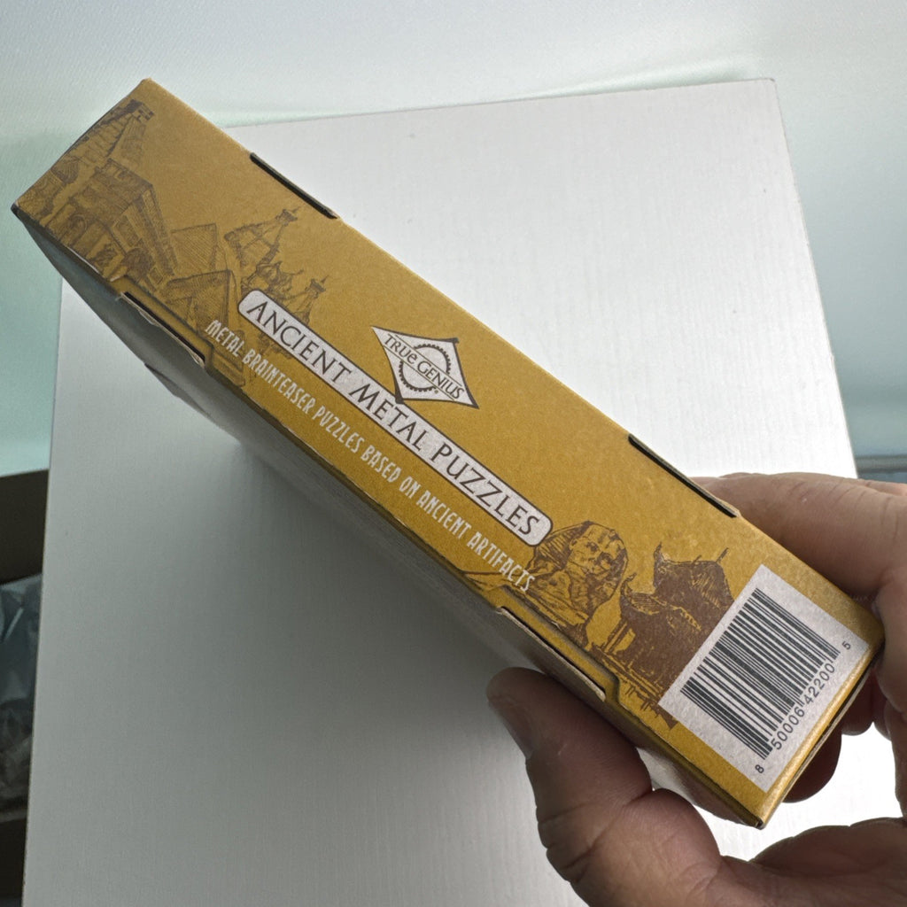 True Genius Ancient Metal Puzzles 12-piece wire brain teaser set in original packaging