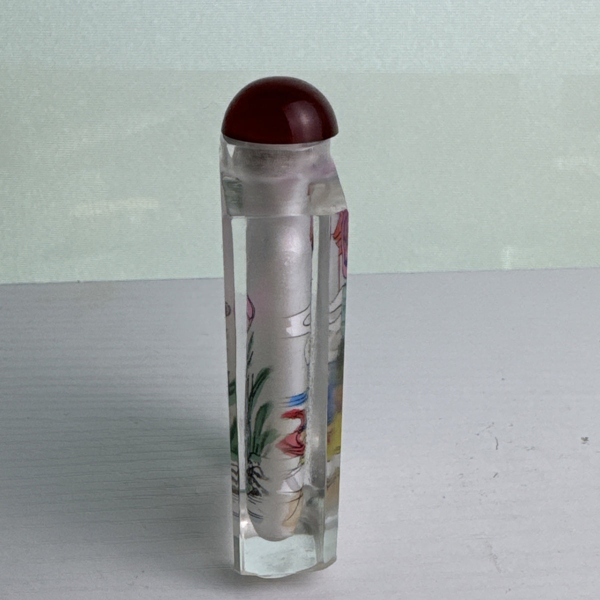 Vintage Chinese inside-painted faceted crystal snuff bottle featuring Yang Guifei with red stopper