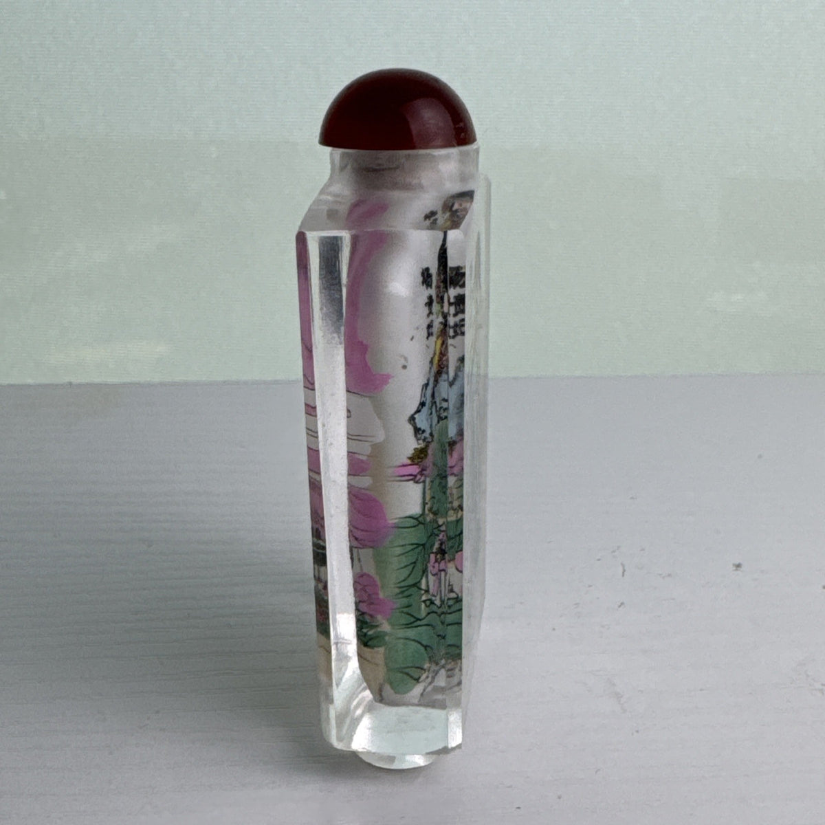 Vintage Chinese inside-painted faceted crystal snuff bottle featuring Yang Guifei with red stopper