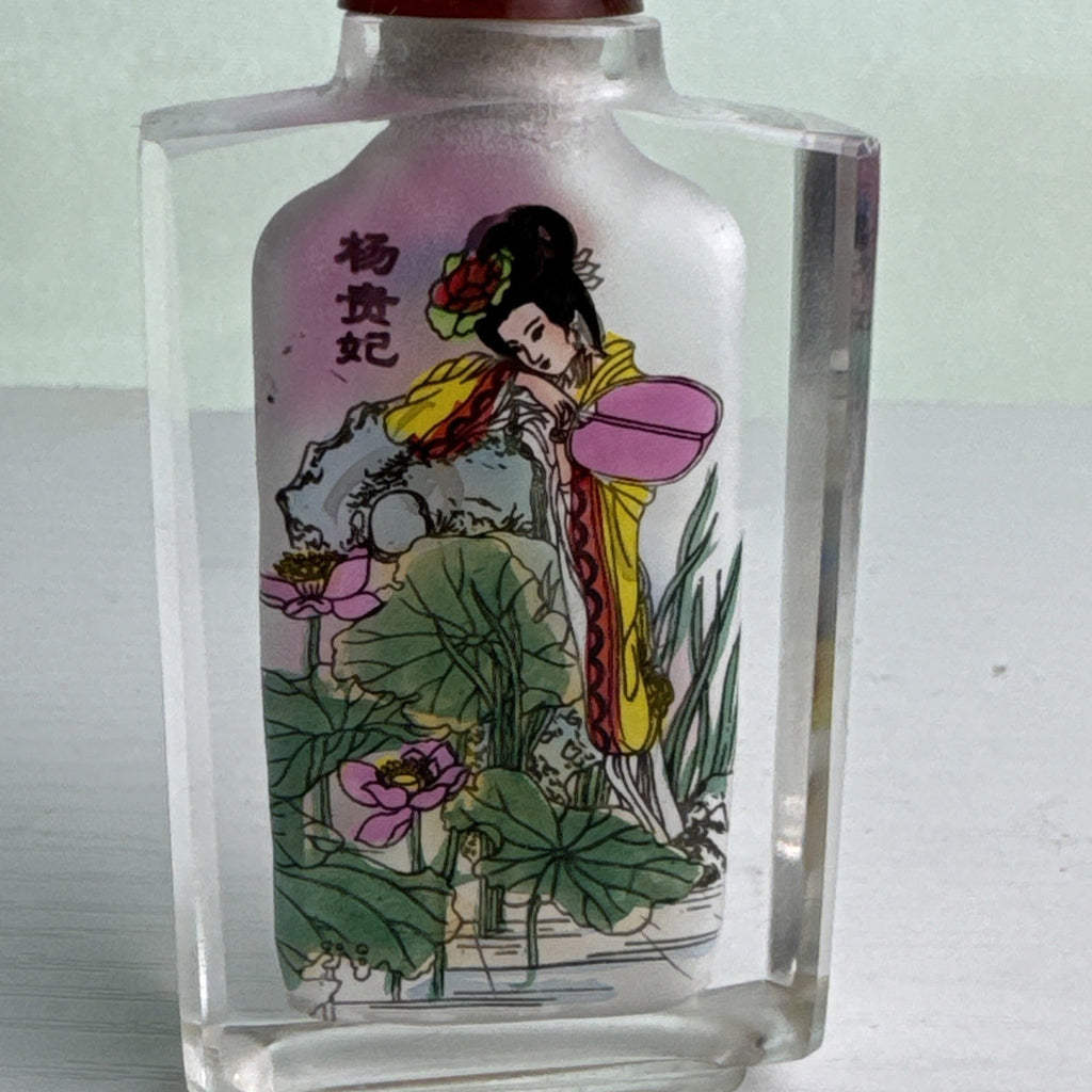 Vintage Chinese inside-painted faceted crystal snuff bottle featuring Yang Guifei with red stopper