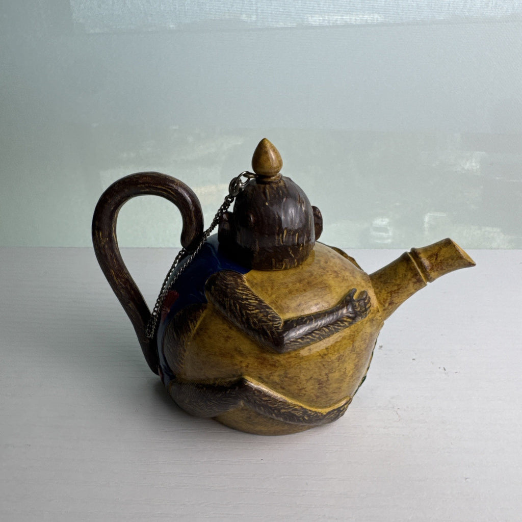 Hand-painted ceramic miniature monkey novelty teapot with bamboo-style spout and chained lid