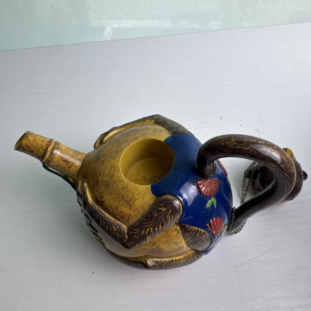 Hand-painted ceramic miniature monkey novelty teapot with bamboo-style spout and chained lid