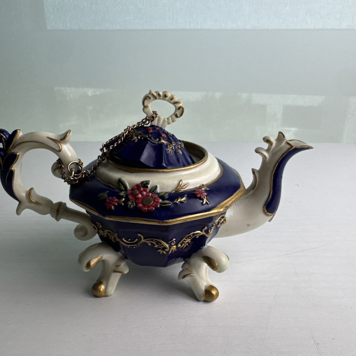 Nini Sahiba cobalt blue resin miniature teapot trinket box with hand-painted 3D floral accents