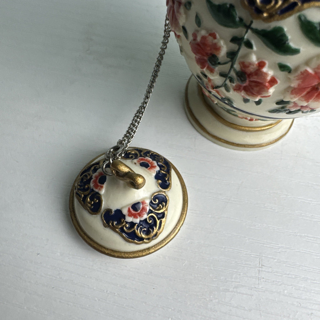 NINI miniature porcelain floral urn teapot with dragon handle and chained lid
