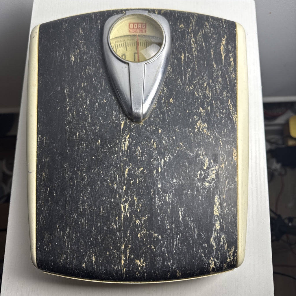 1950s Borg mechanical bathroom scale with chrome teardrop dial and black marbled platform