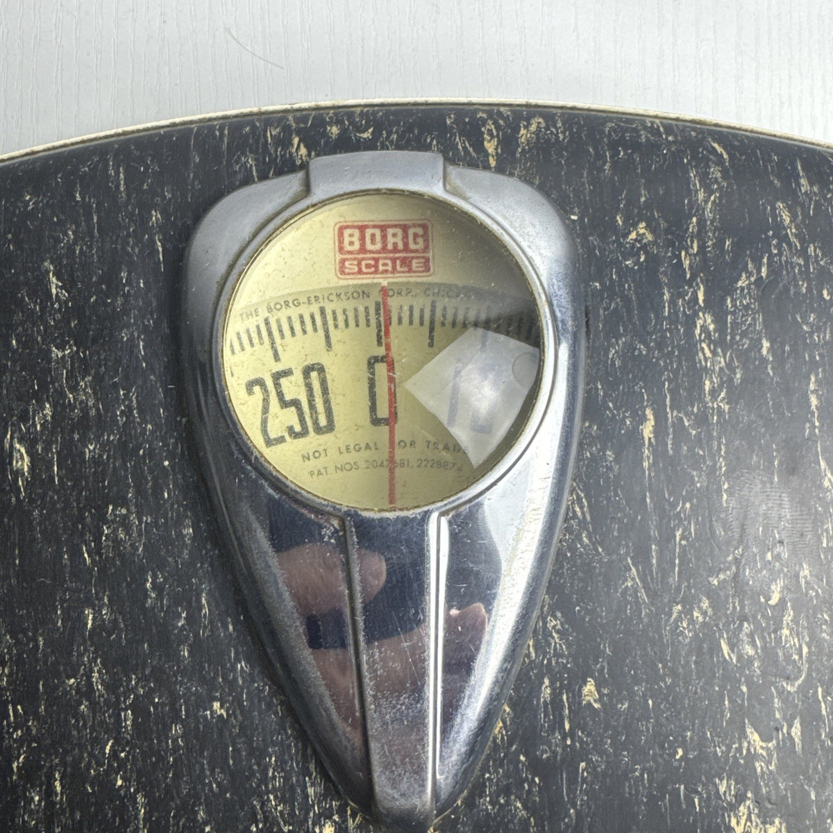 1950s Borg mechanical bathroom scale with chrome teardrop dial and black marbled platform