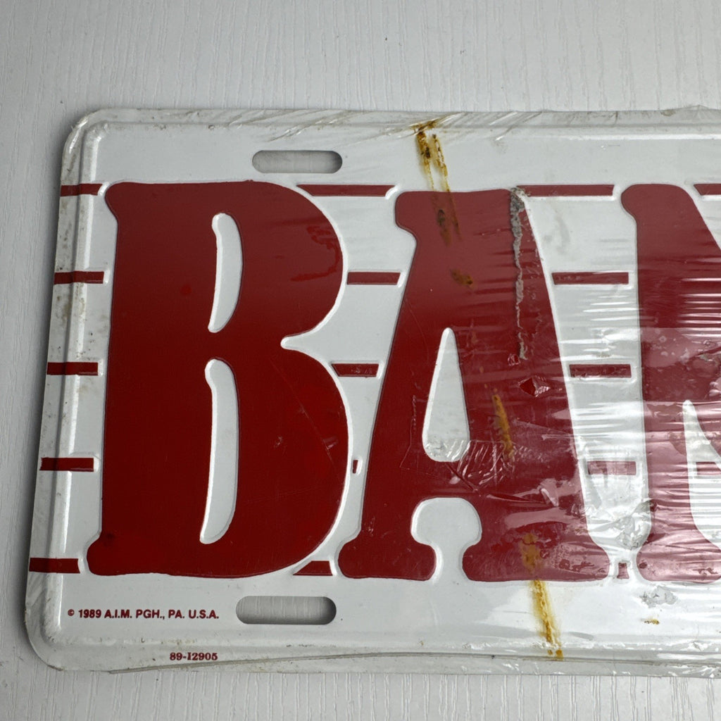 1989 Albert Elovitz embossed metal BAND music novelty license plate, 6x12 inches sealed in original plastic.