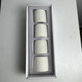 Santa Barbara Design Studio set of four white ceramic napkin rings debossed with entertaining phrases in original box