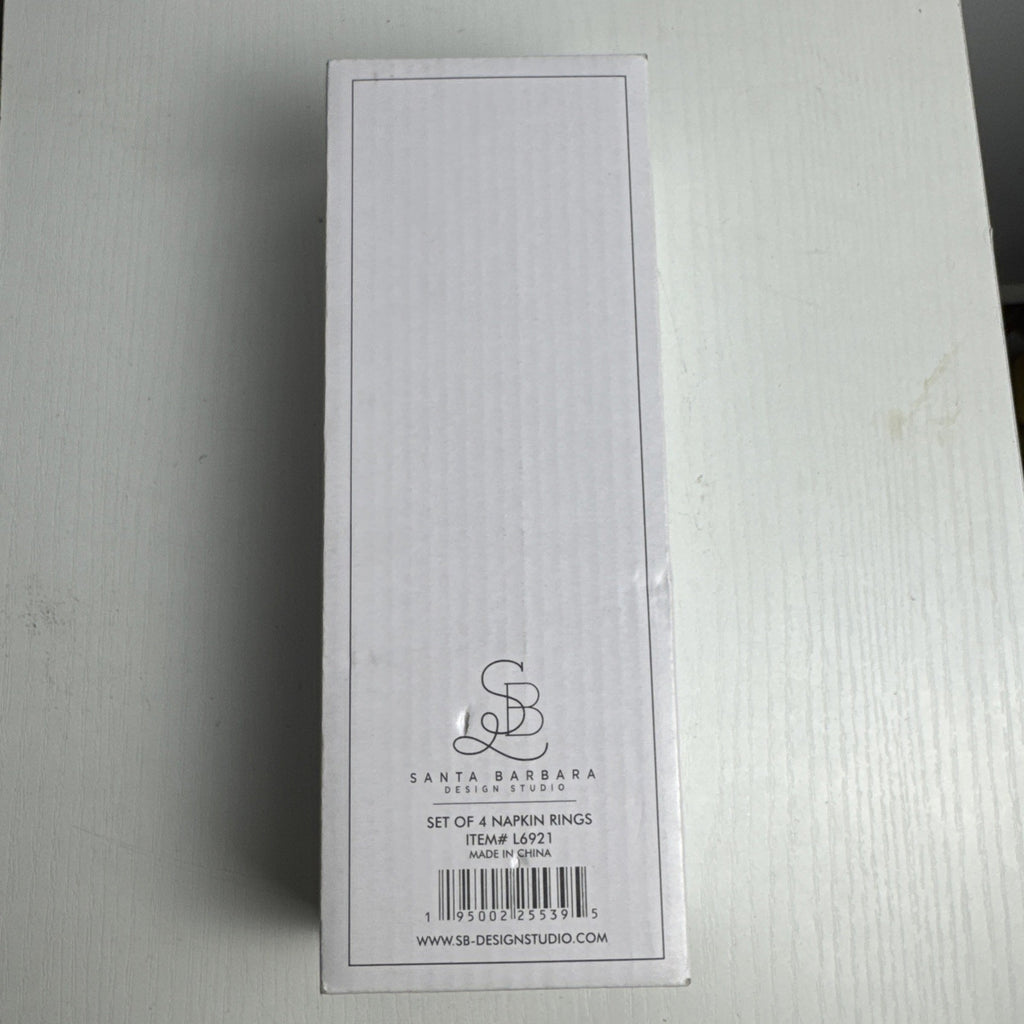 Santa Barbara Design Studio set of four white ceramic napkin rings debossed with entertaining phrases in original box