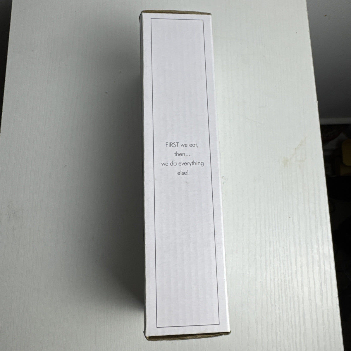 Santa Barbara Design Studio set of four white ceramic napkin rings debossed with entertaining phrases in original box