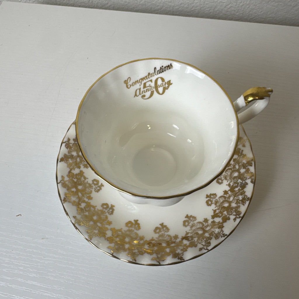 Royal Albert 50th anniversary gold and white fine porcelain teacup and saucer set made in the UK