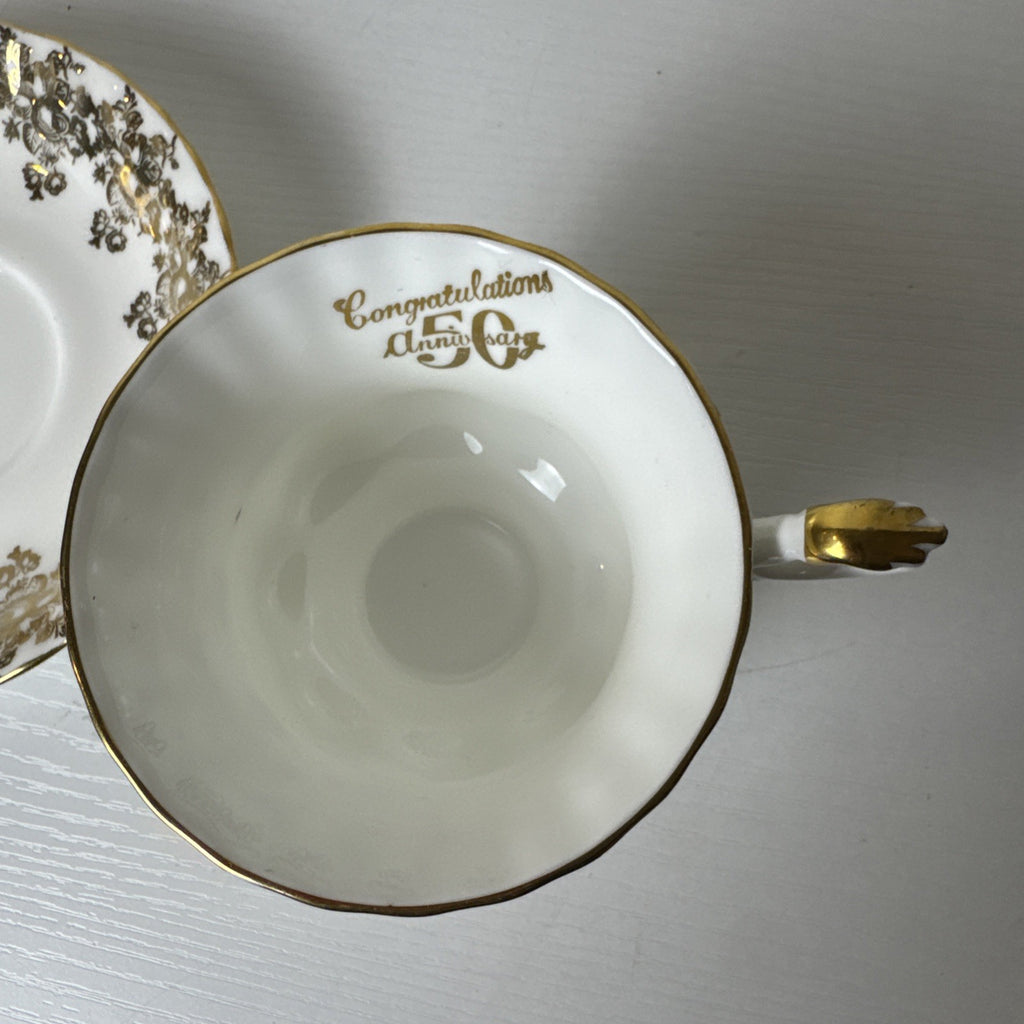 Royal Albert 50th anniversary gold and white fine porcelain teacup and saucer set made in the UK