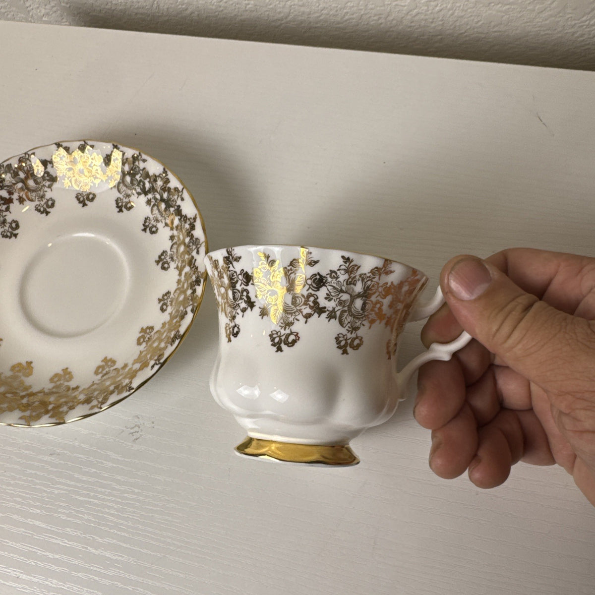 Royal Albert 50th anniversary gold and white fine porcelain teacup and saucer set made in the UK