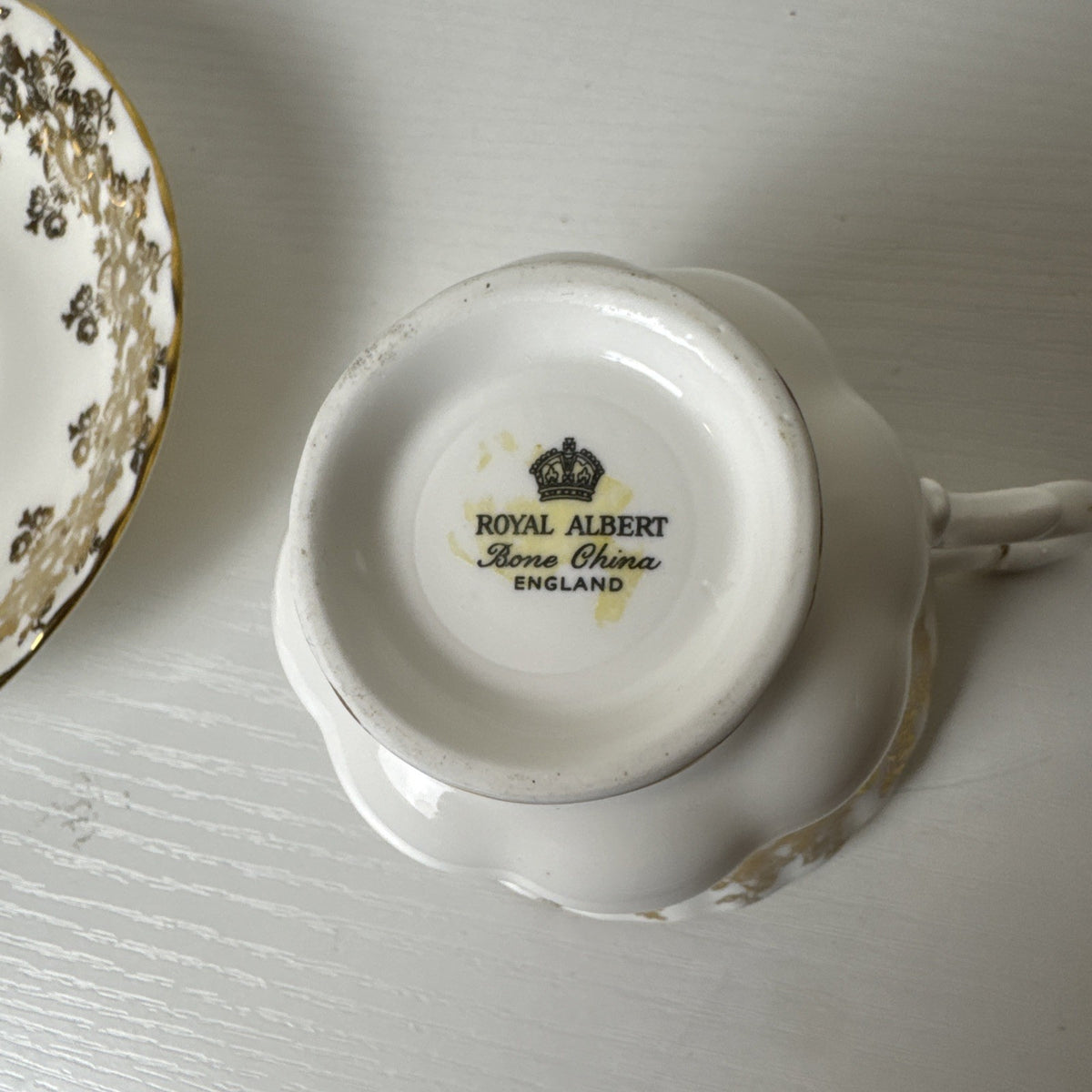 Royal Albert 50th anniversary gold and white fine porcelain teacup and saucer set made in the UK