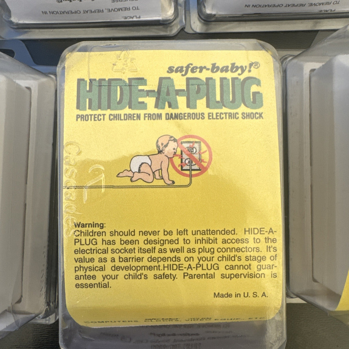 Lot of 9 sealed vintage Safer-Baby Hide-A-Plug outlet covers in original packaging made in USA.