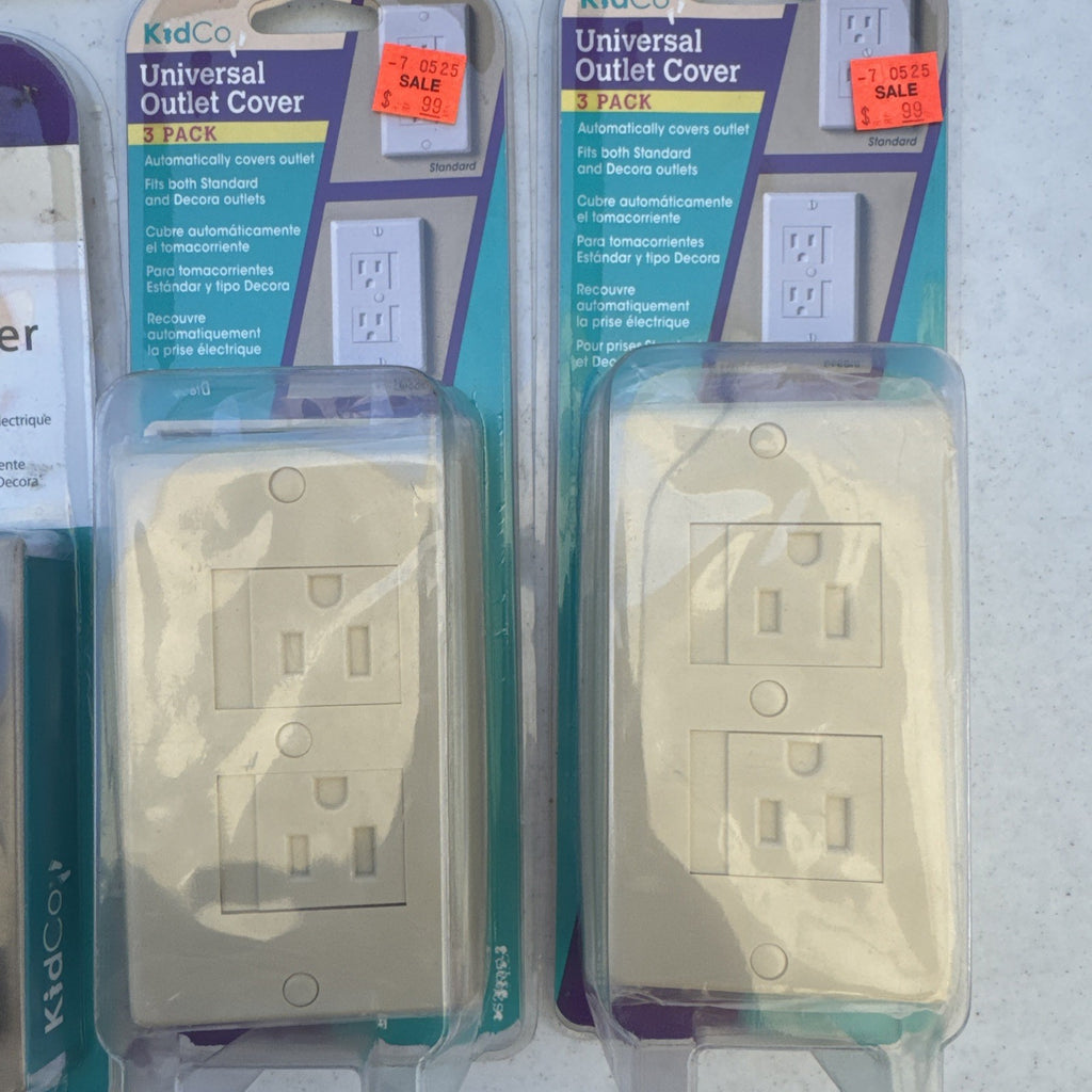 Lot of 10 packaged KidCo auto-closing safety outlet covers in beige and white for standard and Decora outlets.