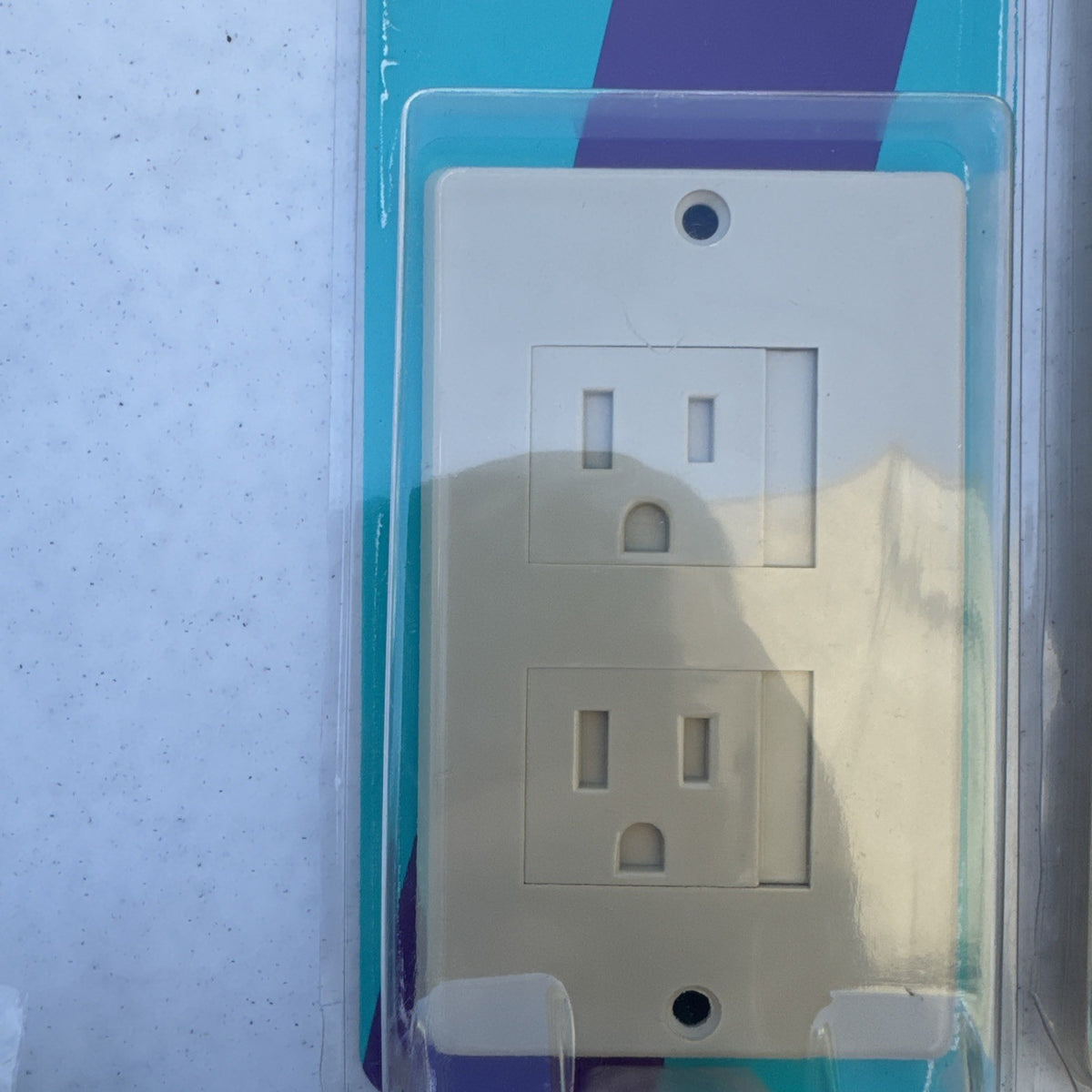 Lot of 10 packaged KidCo auto-closing safety outlet covers in beige and white for standard and Decora outlets.