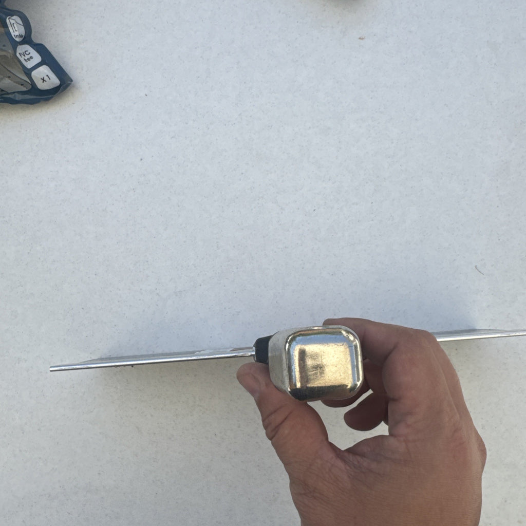 Husky 12 inch blue spring steel taping knife featuring soft grip handle and integrated hammer end