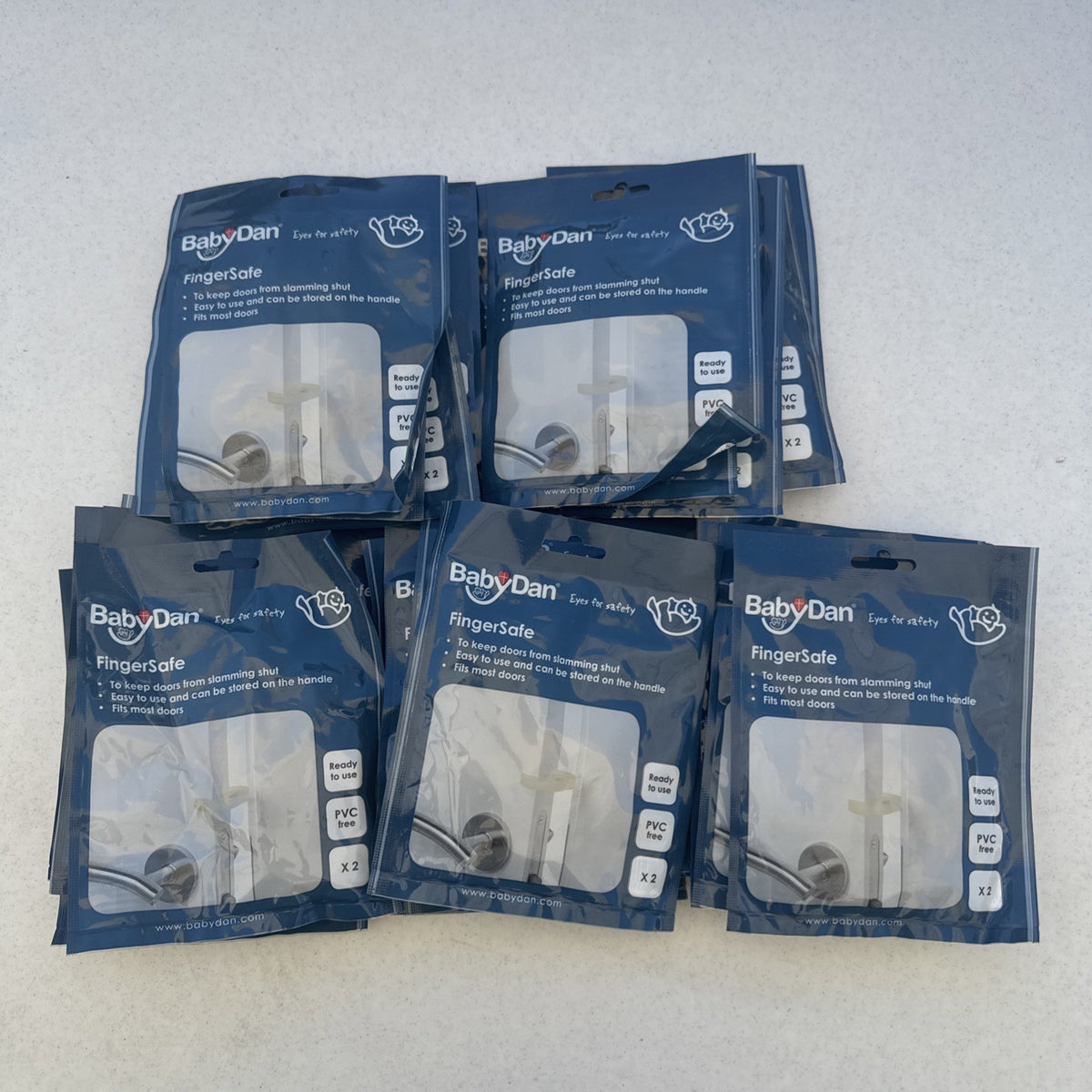 Bulk lot of 25 brand new packs of clear BabyDan FingerSafe door guards, total 50 stoppers.