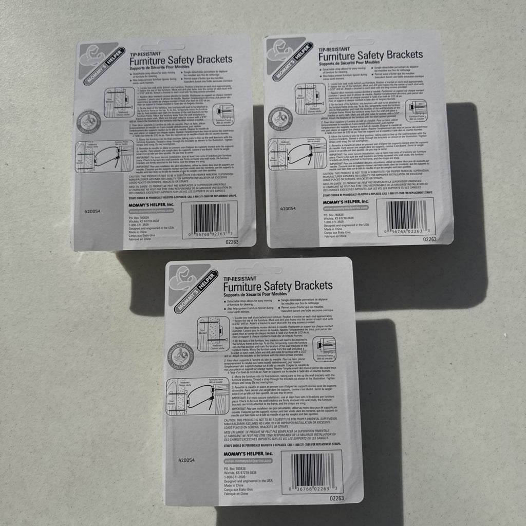 Three sealed packages of Mommy's Helper tip-resistant furniture safety brackets model 02263.
