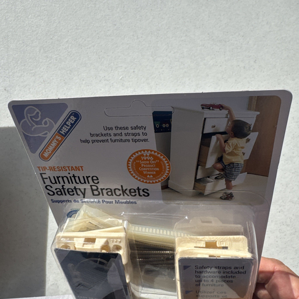 Three sealed packages of Mommy's Helper tip-resistant furniture safety brackets model 02263.