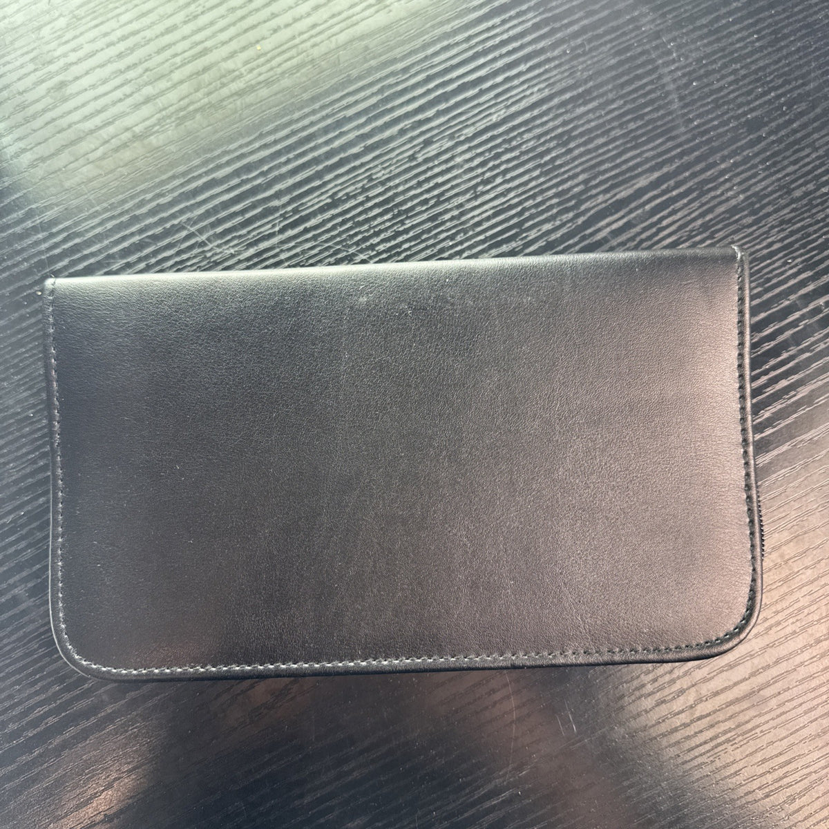 Black Beltone faux leather zip-around organizer case with interior pockets and elastic loops
