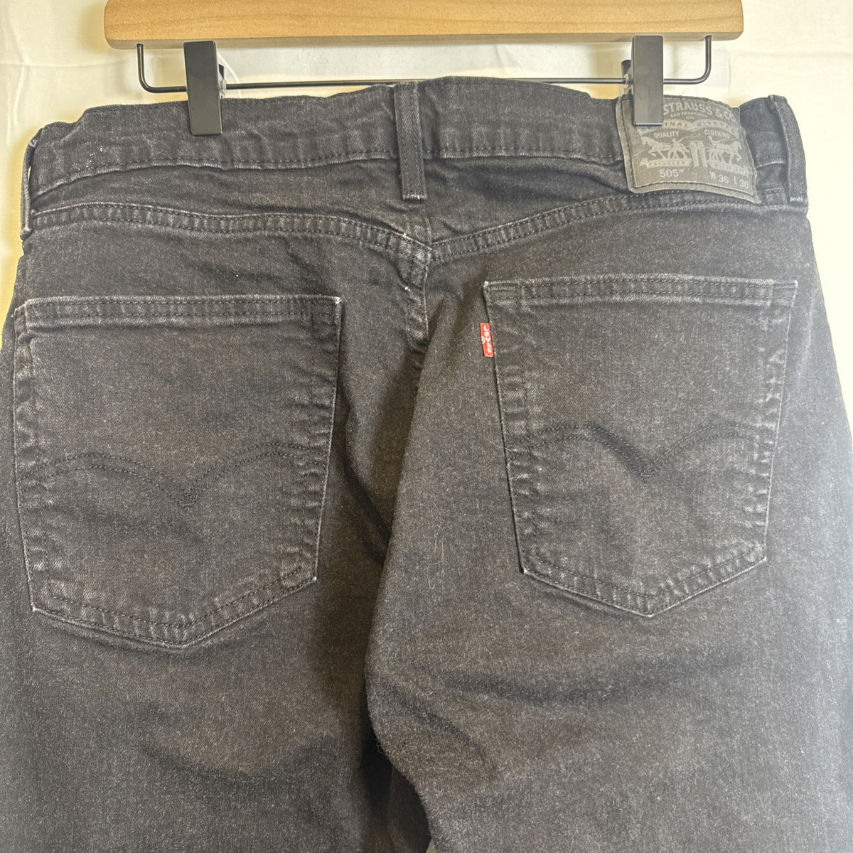 Levi's 505 men's slim straight black denim jeans size 34x27 in good pre-owned condition