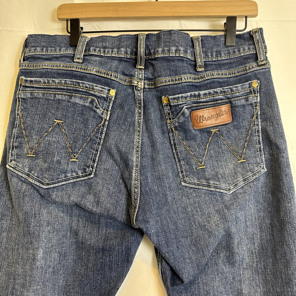 Wrangler Retro slim bootcut men's denim blue jeans in size 34x27 with medium wash
