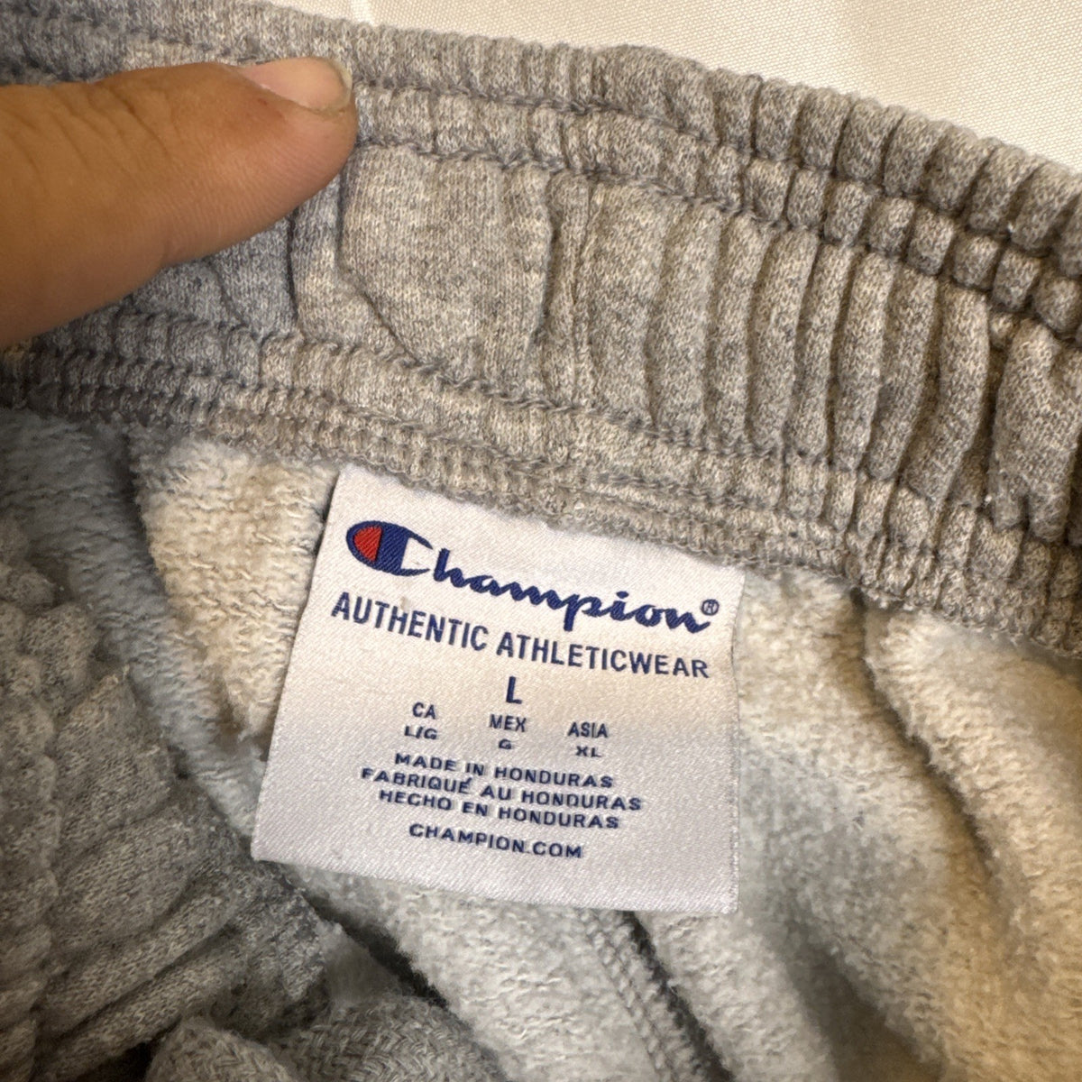 Champion men's gray cotton blend fleece sweatpants in size Large with drawstring elastic waist and logo.
