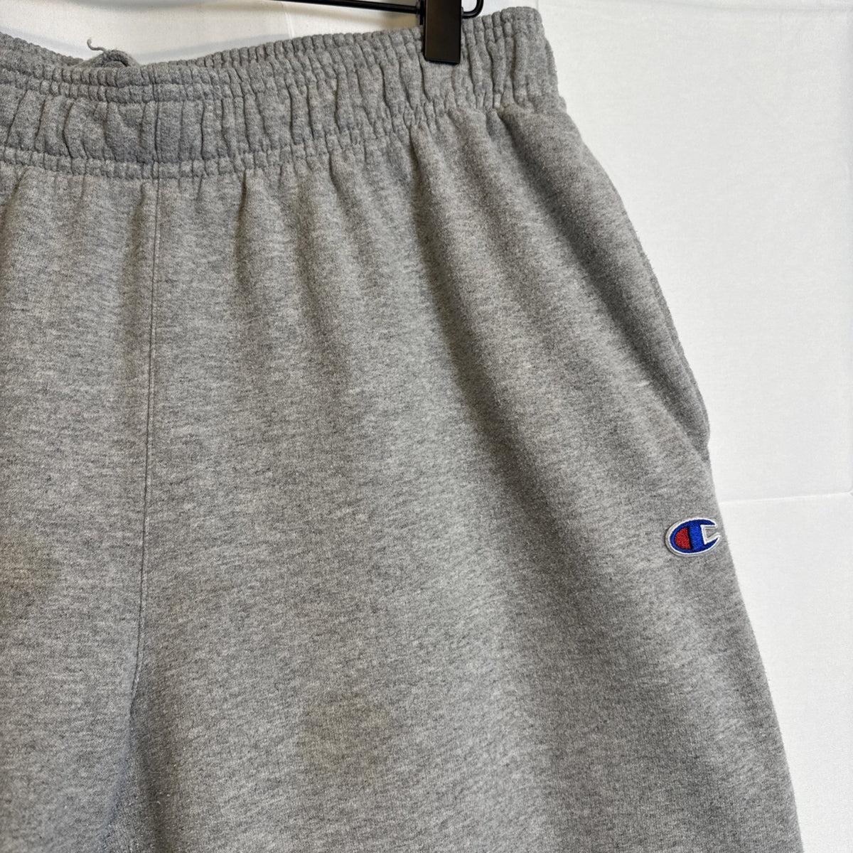 Champion men's gray cotton blend fleece sweatpants in size Large with drawstring elastic waist and logo.
