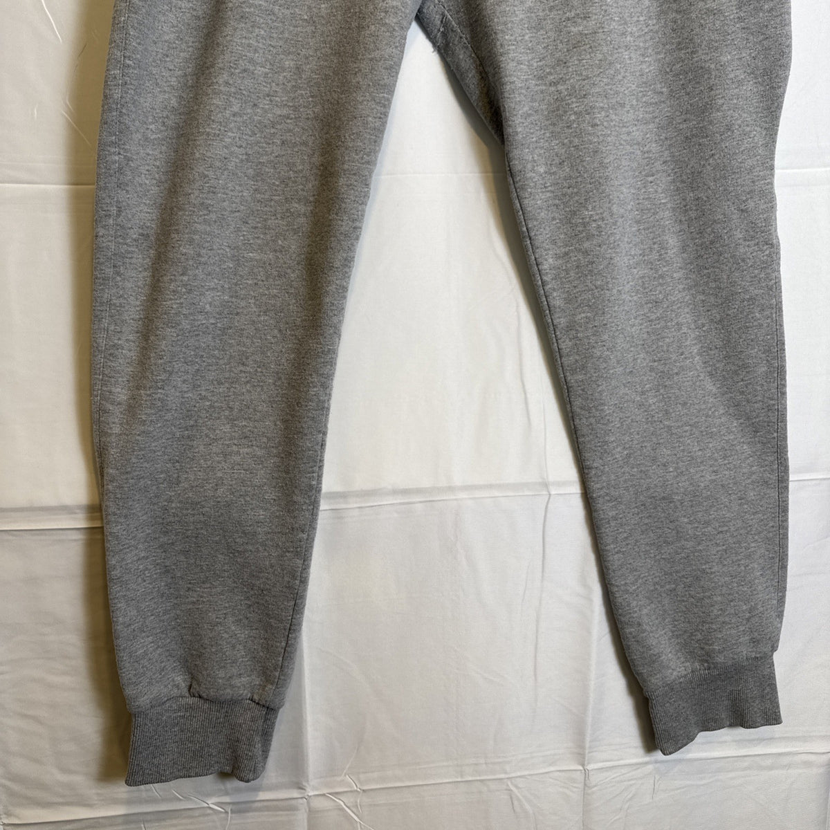 Champion men's gray cotton blend fleece sweatpants in size Large with drawstring elastic waist and logo.