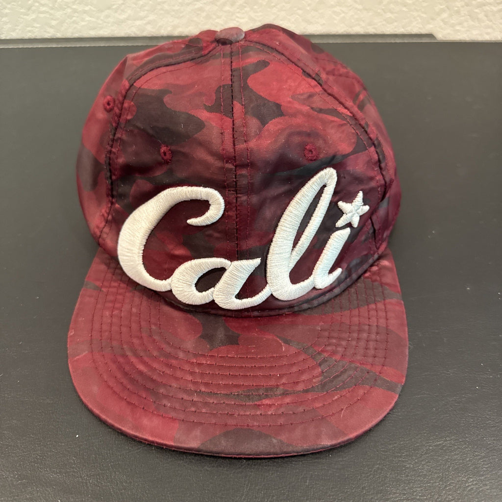 Red and burgundy camo snapback hat with white 3D embroidered Cali script logo