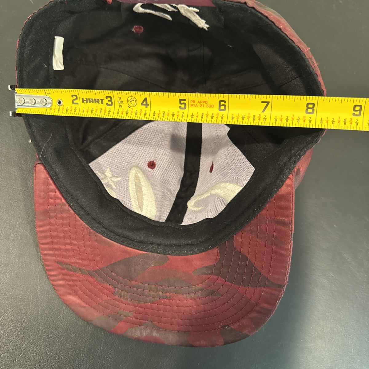 Red and burgundy camo snapback hat with white 3D embroidered Cali script logo