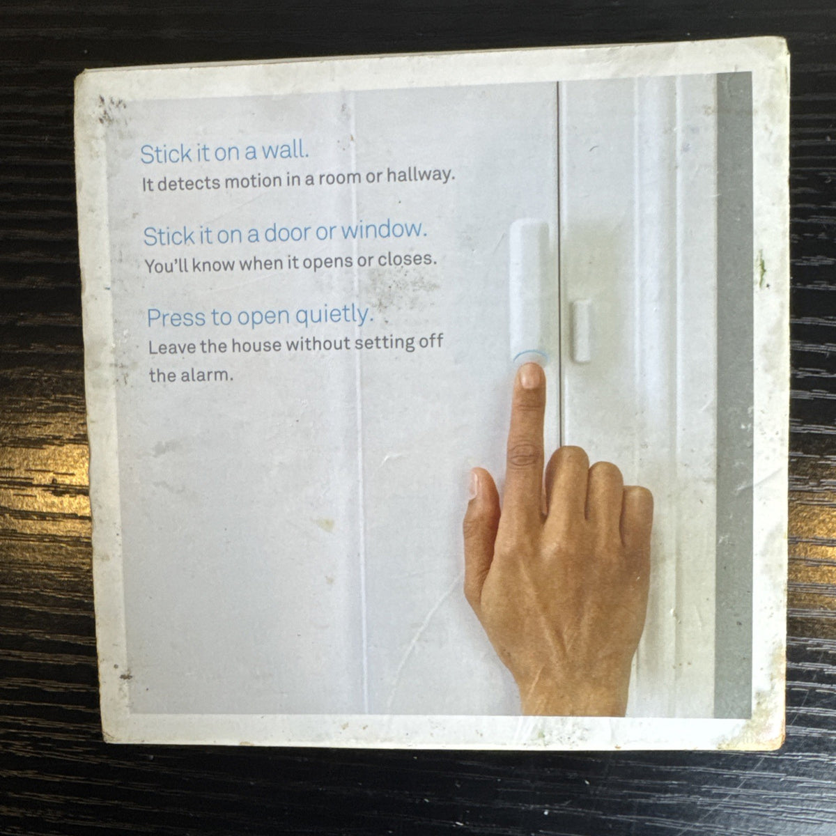 Open box Google Nest Detect H1100WES wireless door and window sensor showing its sleek white design.