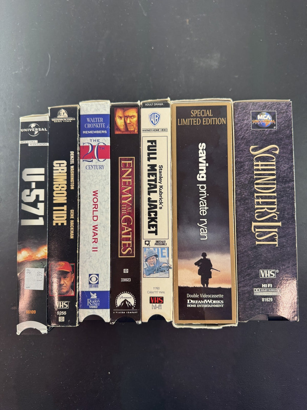 Lot of 7 war movie VHS tapes including Saving Private Ryan, Full Metal Jacket, and Schindler's List