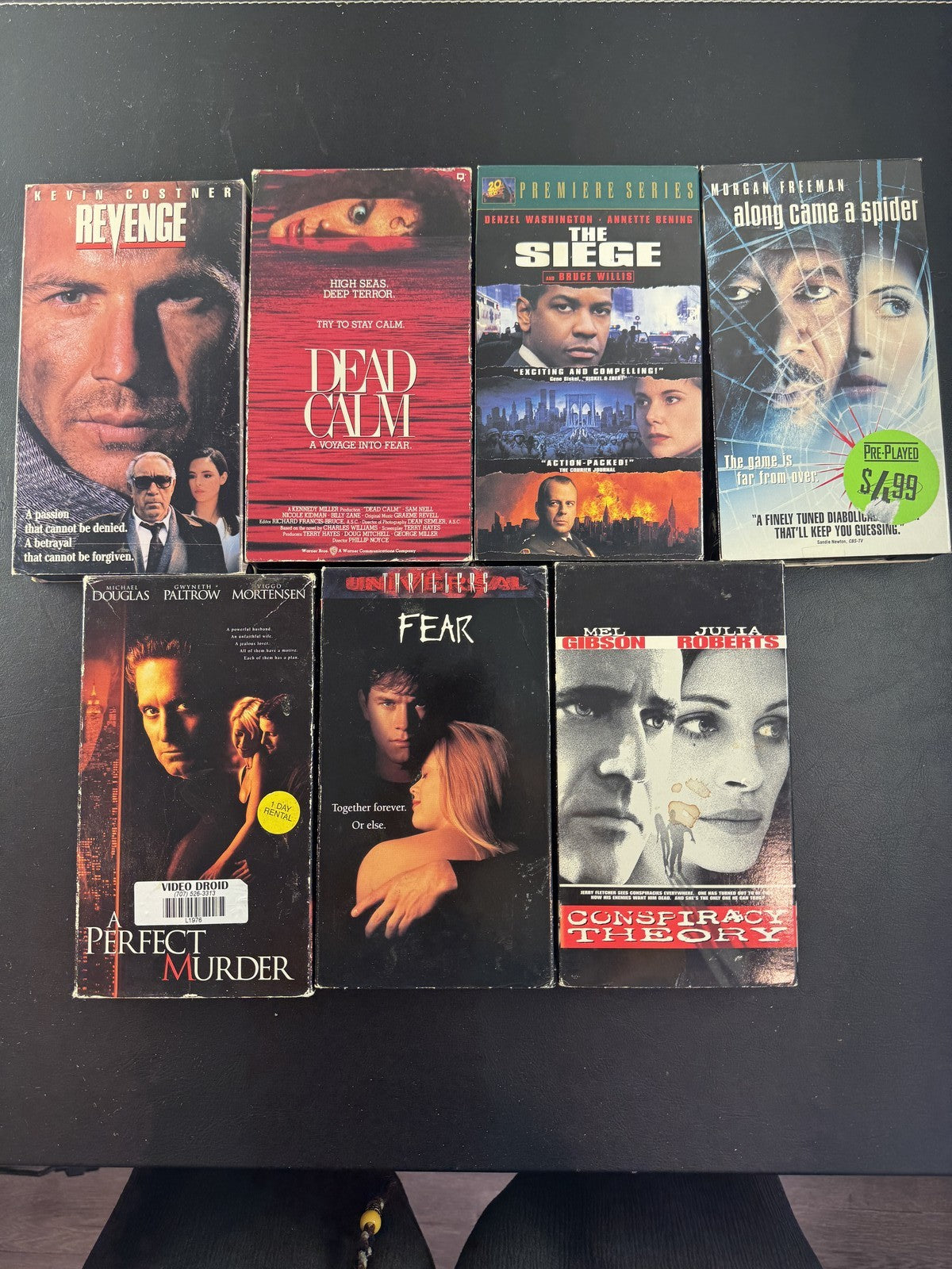 Set of 7 90s suspense thriller VHS tapes including Conspiracy Theory and A Perfect Murder.