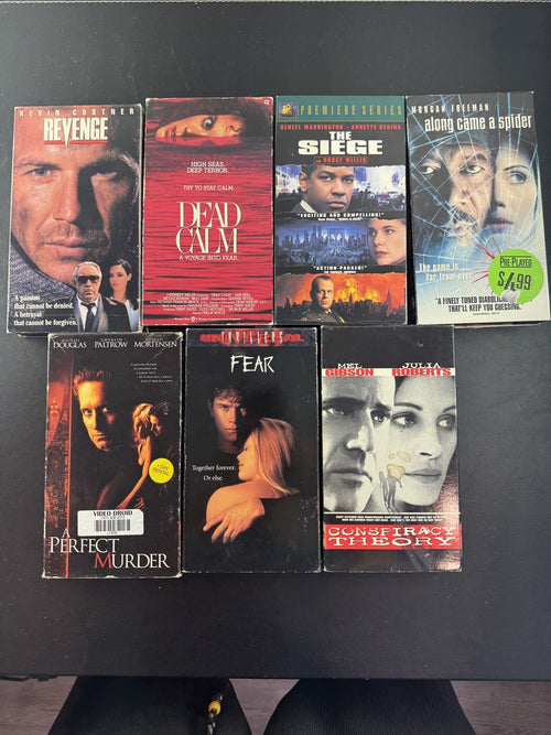 Set of 7 90s suspense thriller VHS tapes including Conspiracy Theory and A Perfect Murder.